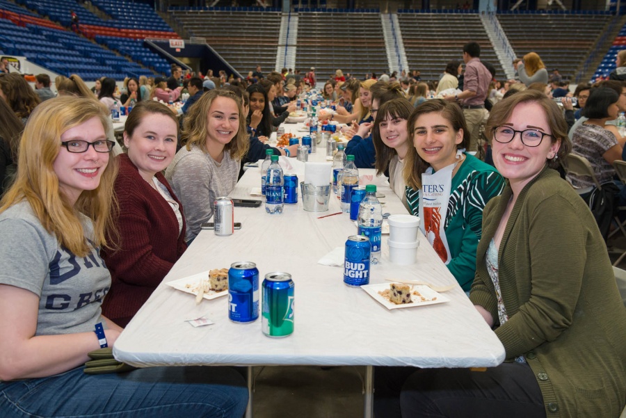 UNH seniors celebrating their impending graduation with classmates over lobster in the rough 