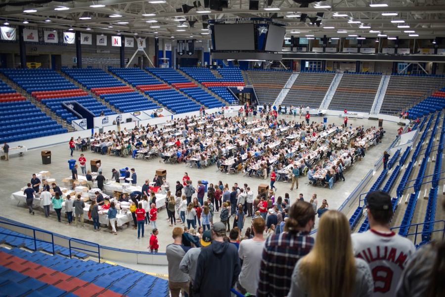 UNH seniors celebrating their impending graduation with classmates over lobster in the rough 