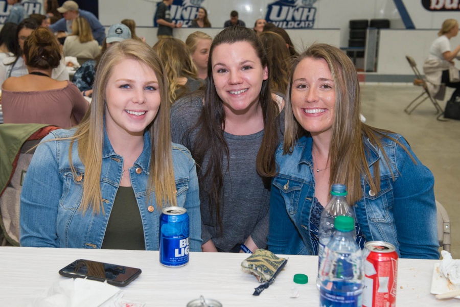 UNH seniors celebrating their impending graduation with classmates over lobster in the rough 