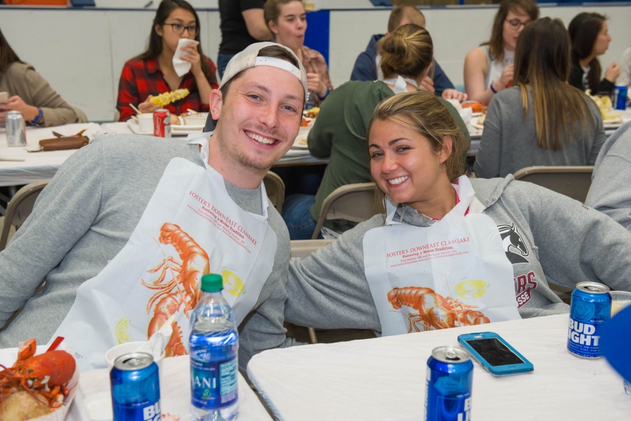 UNH seniors celebrating their impending graduation with classmates over lobster in the rough 