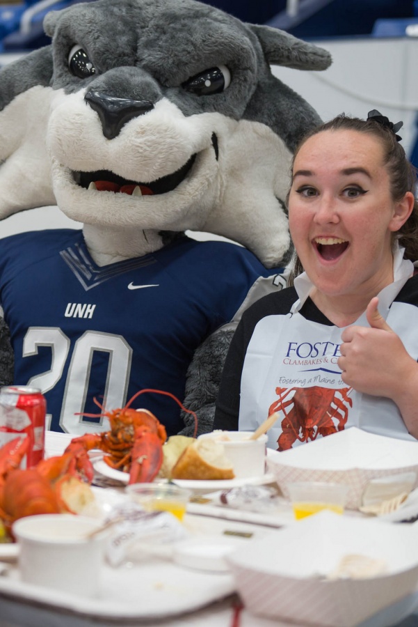 UNH seniors celebrating their impending graduation with classmates over lobster in the rough 