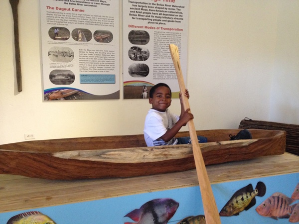 boy in dug-out canoe