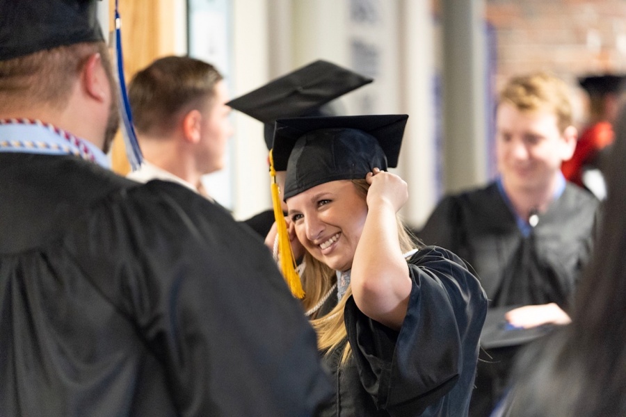 UNH Manchester graduates congratulating one another