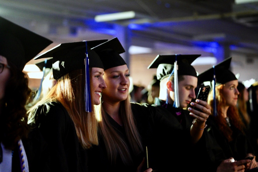 UNH Manchester graduates pose for a selfie during commencement 2018