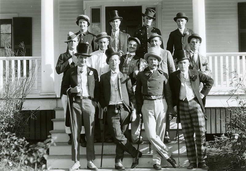 candidates from the 1930 Mayoralty campaign standing on steps, with top hats and canes