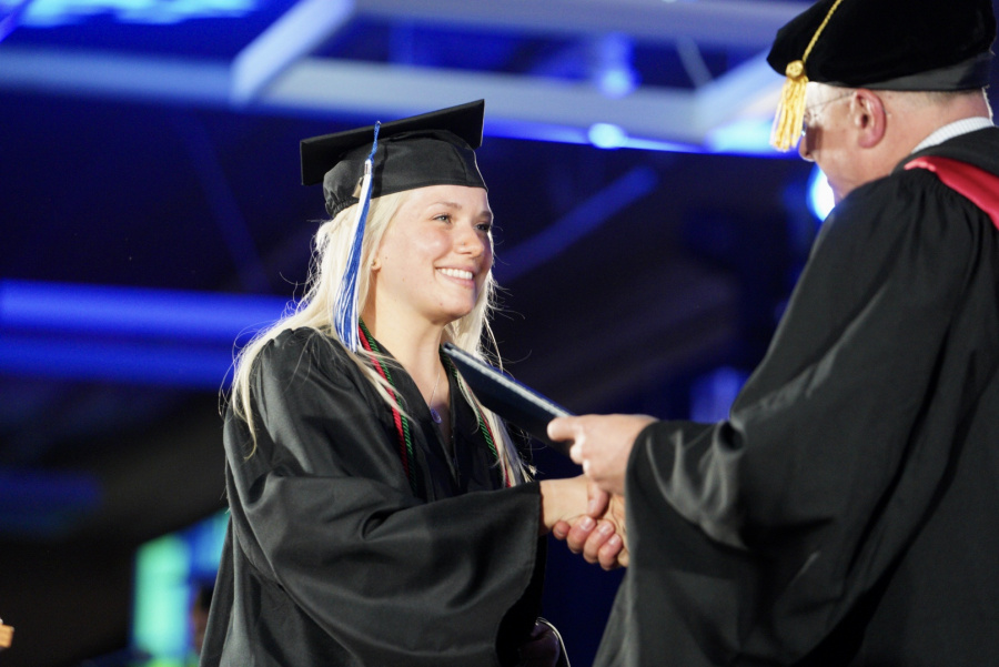 UNH Manchester student accepts her degree