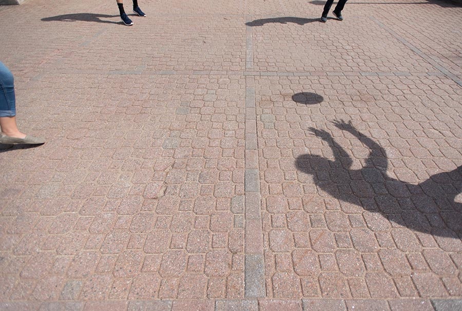 shadow of a person playing ball