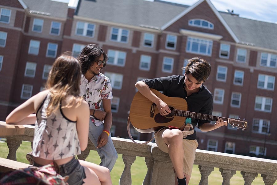 students playing guitar at UNH
