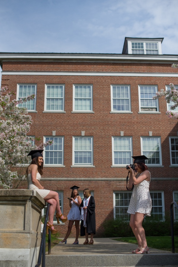 UNH seniors pose for pre-graduation pictures on campus during the week before commencement