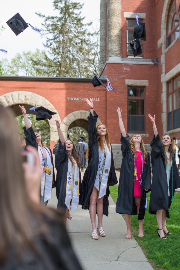 UNH seniors pose for pre-graduation pictures on campus during the week before commencement