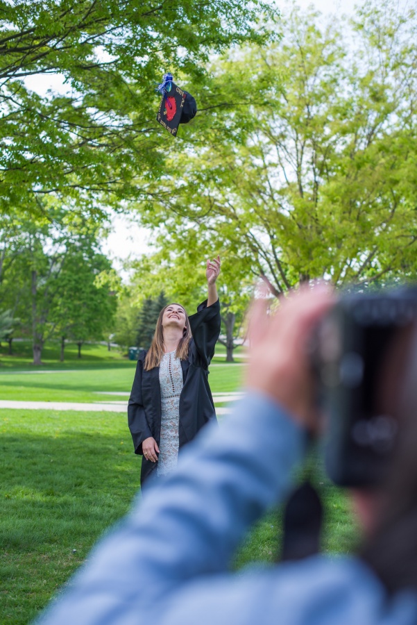 UNH seniors pose for pre-graduation pictures on campus during the week before commencement