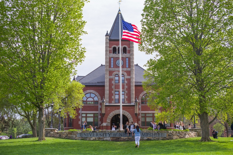 UNH seniors pose for pre-graduation pictures on campus during the week before commencement