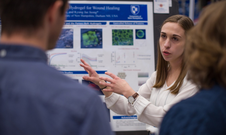 A University of New Hampshire student presenting research results during the 2018 Interdisciplinary Science and Engineering Symposium, part of the annual UNH Undergraduate Research Conference