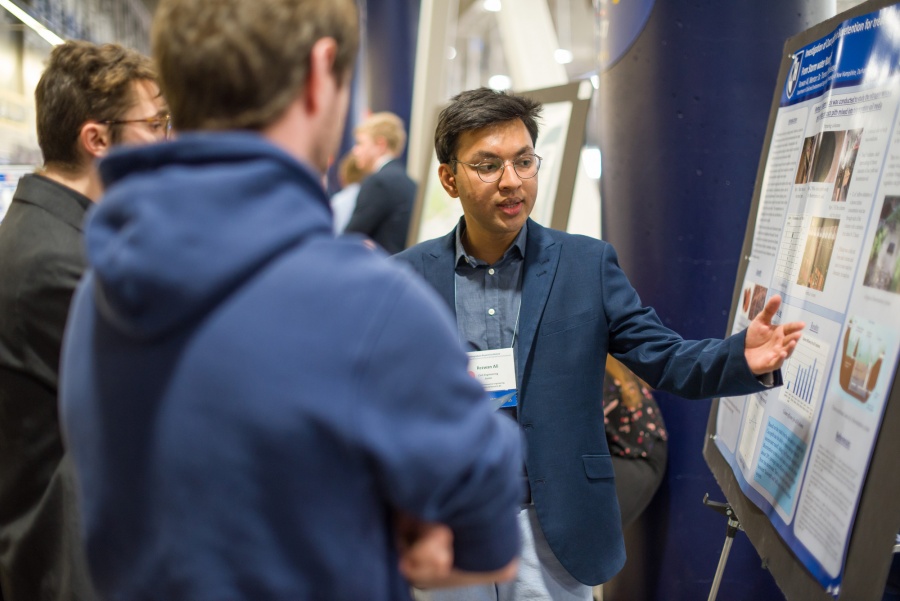 A University of New Hampshire student presenting research results during the 2018 Interdisciplinary Science and Engineering Symposium, part of the annual UNH Undergraduate Research Conference
