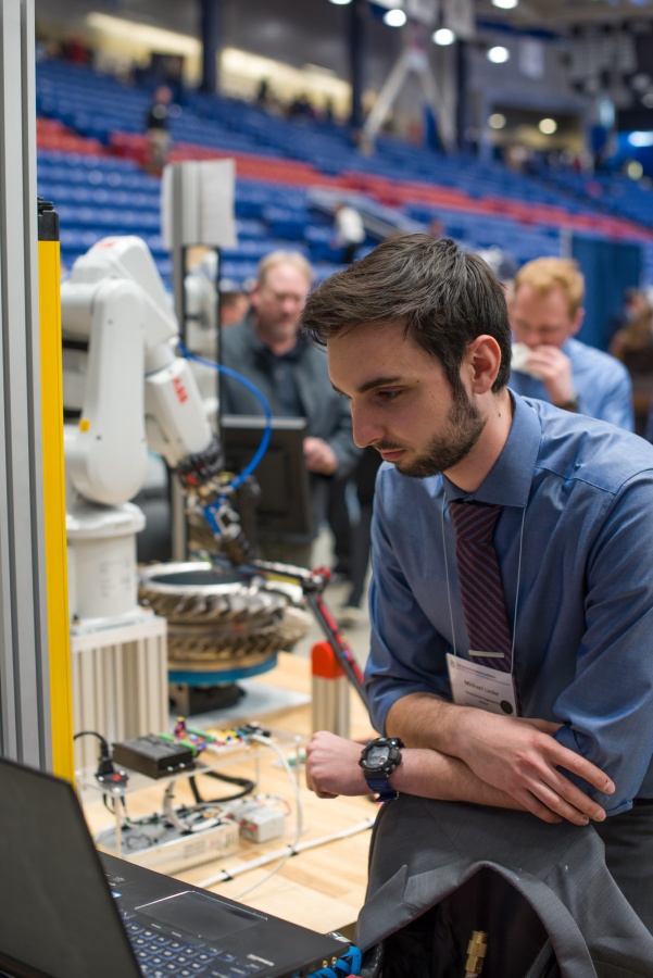 A University of New Hampshire student presenting research results during the 2018 Interdisciplinary Science and Engineering Symposium, part of the annual UNH Undergraduate Research Conference