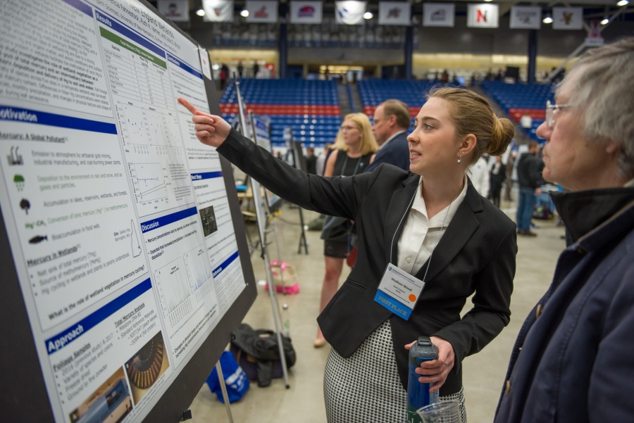 A University of New Hampshire student presenting research results during the 2018 Interdisciplinary Science and Engineering Symposium, part of the annual UNH Undergraduate Research Conference