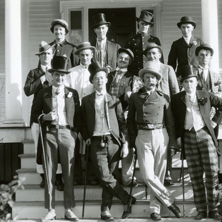 candidates from the 1930 Mayoralty campaign standing on steps, with top hats and canes