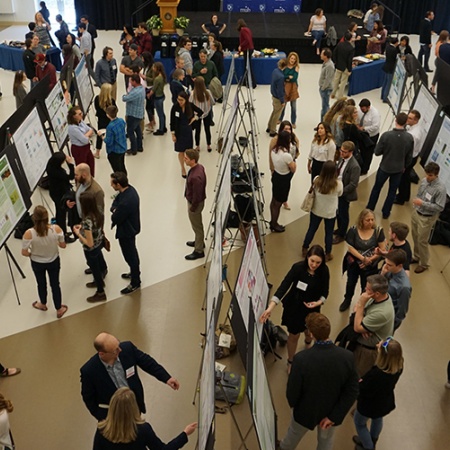 Aerial view of presenters at COLSA's URC poster presentation.