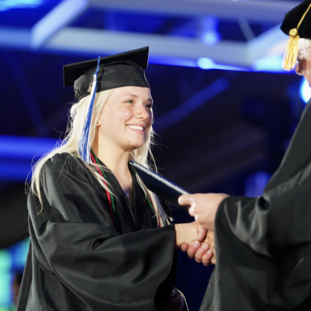 UNH Manchester student accepts her degree