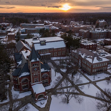 aerial view of UNH's Durham campus at sunset in winter