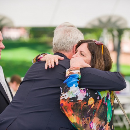 UNH outgoing president Mark Huddleston gets a hug