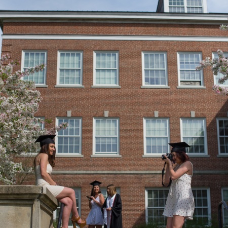 UNH seniors pose for pre-graduation pictures on campus during the week before commencement