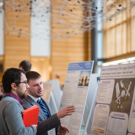 A University of New Hampshire student presenting research results during the 2018 Paul College of Business and Economics Undergraduate Research Conference