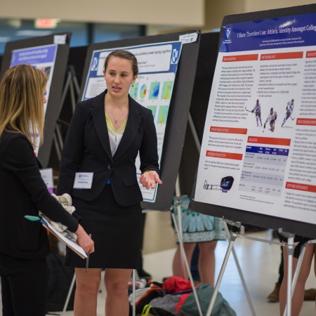 A UNH student presenting the results of her research during the UNH College of Life Sciences and Agriculture Undergraduate Research Conference 2018