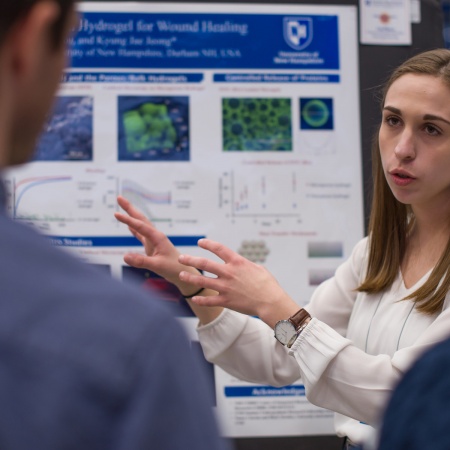 A University of New Hampshire student presenting research results during the 2018 Interdisciplinary Science and Engineering Symposium, part of the annual UNH Undergraduate Research Conference