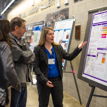 A University of New Hampshire student presenting research results during the 2018 Interdisciplinary Science and Engineering Symposium, part of the annual UNH Undergraduate Research Conference