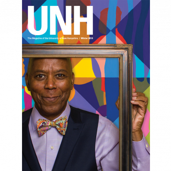 UNH Magazine Winter 2019 Cover - Richard Haynes holding a picture frame 