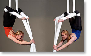 Two aerial dancers perform