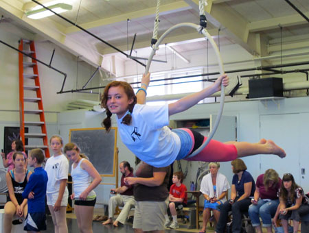 A young camper practices on the lyra during the aerial summer camp offered through the theater and dance department.