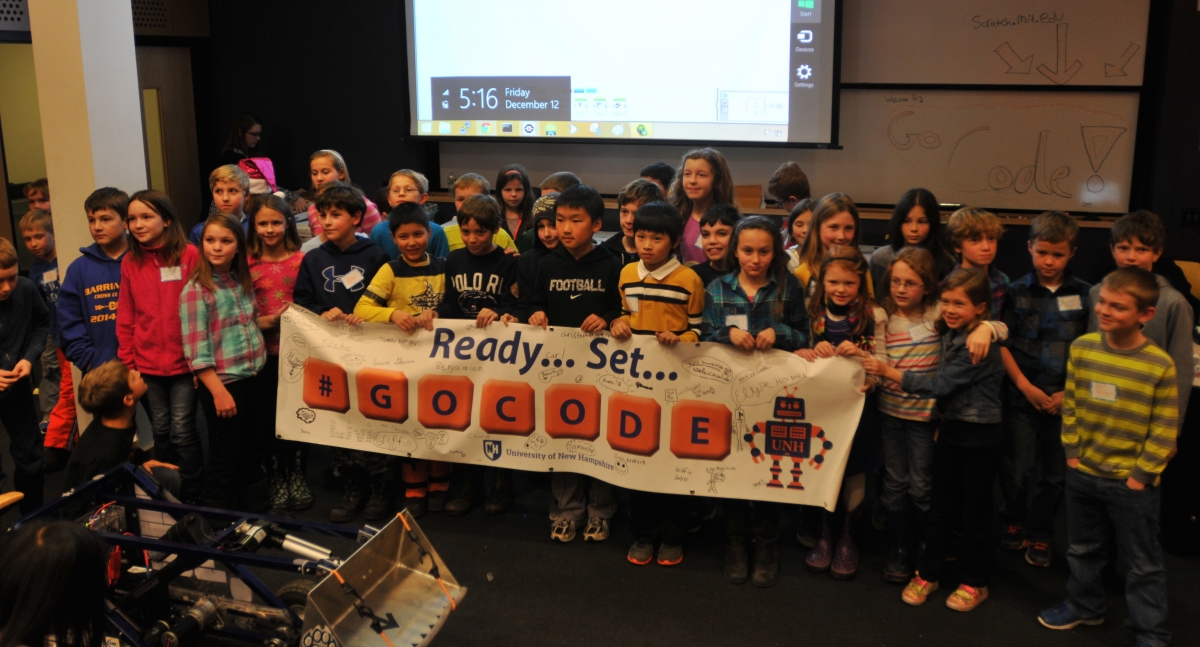 Kids holding poster that says GoCode