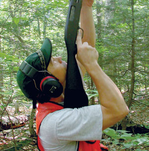 Scott Ollinger shoots leaves from the canopy of trees in the Bartlett Experimental Forest. Leaf chemistry is analyzed and combined with "hyperspectral" remotely sensed images to provide an accurate gauge of forest productivity. Photo courtesy of Scott Ollinger.
