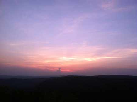 Wilderness-certified guides, led a trek up South Mountain at Pawtuckaway State Park to witness the Summer Solstice sunset on Wednesday, June 20, 2012.