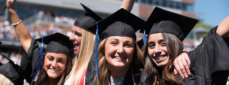 Portrait Of Young Man In Graduation Gown On Campus High-Res Stock Photo -  Getty Images