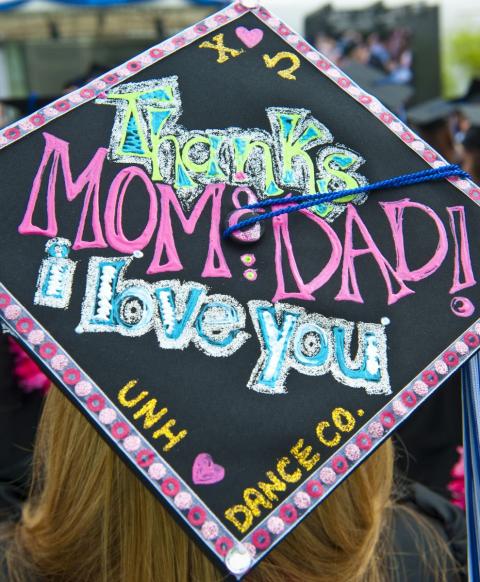 Commencement cap decorated with, "Thanks, Mom and Dad! I love you."