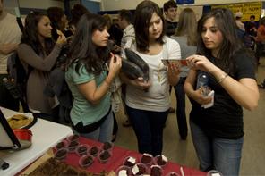 Students at a booth at the Commencement Fair