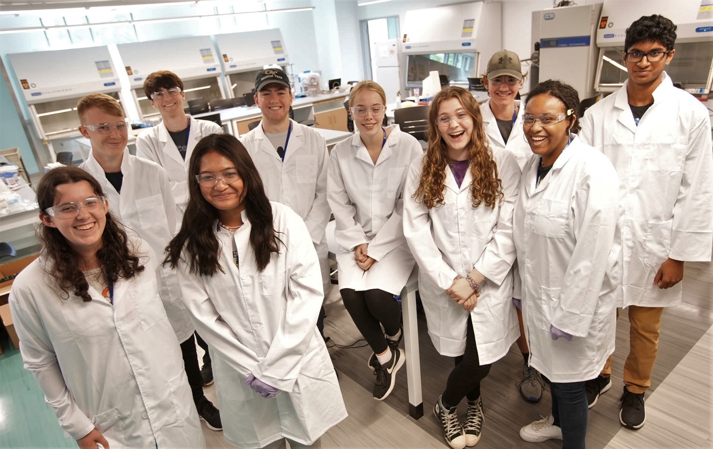 UNH Tech Camp high school students in white lab coats 