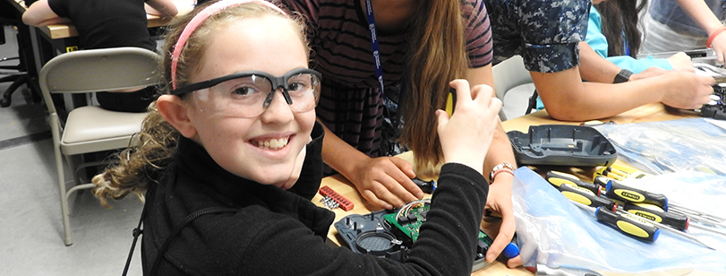 Young female student working on circuitry board