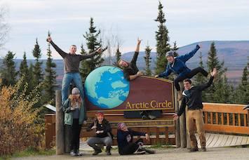 NSE students posing with Arctic Circle sign